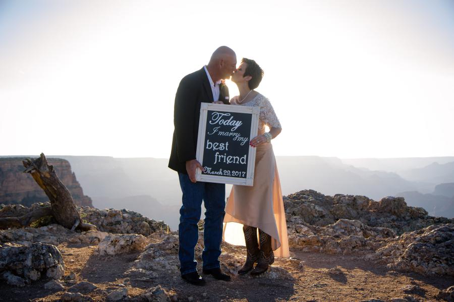grand canyon wedding bride and groom holding sign